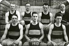 7 members of the 1915 UM basketball team. The coach is in the upper right of the photo and all members are in their uniforms.