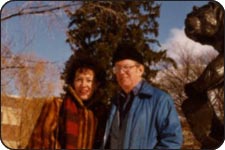 Patricia Goedicke and Leonard Wallace Robinson in front of the Grizzly statue on the UM campus.